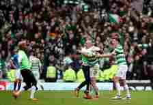 Scott Brown of Celtic and his team mates celebrate victory after the Ladbrokes Scottish Premiership match between Rangers and Celtic at Ibrox Stadi...