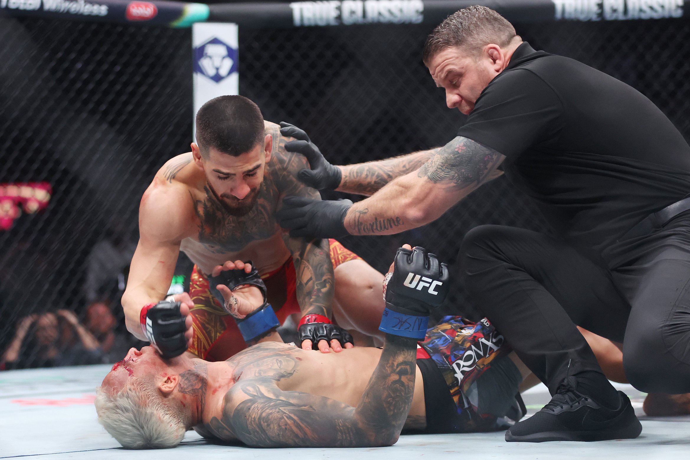 Ilia Topuria put Charles Oliveira out cold to become a two-weight UFC champion