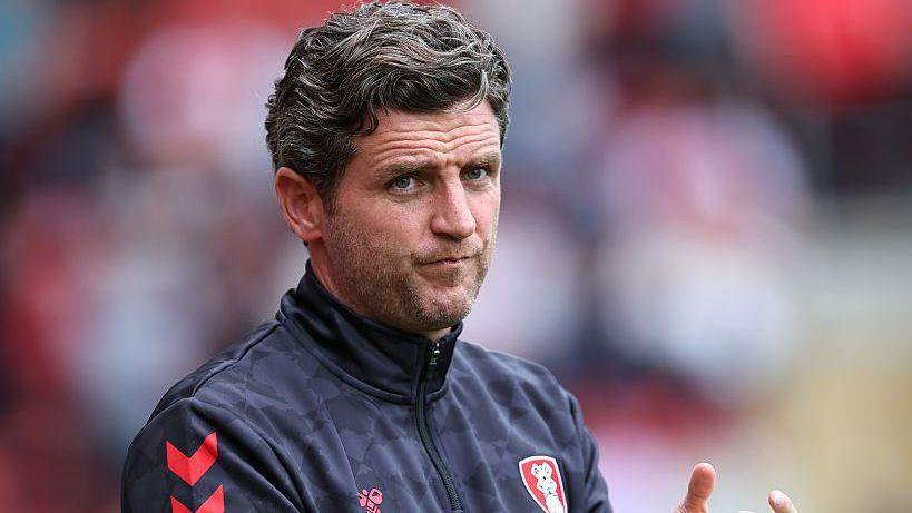Alex Bruce watches on from the sidelines at his Rotherham United side