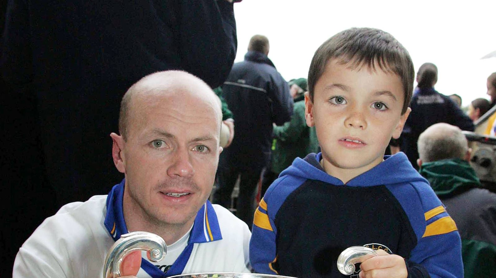 Peter and a six-year-old Darragh Canavan  pictured after Errigal Ciaran won the county title in 2006. Darragh followed in his father's footsteps on Friday night. Picture: Oliver McVeigh