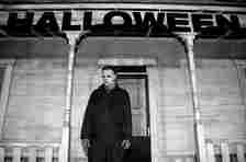 An actor posing as Michael Myers from the Halloween films the premiere of Universal Pictures' "Halloween".