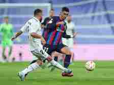 Barcelona's Ferran Torres in action with Real Madrid's Dani Carvajal on March 2, 2023