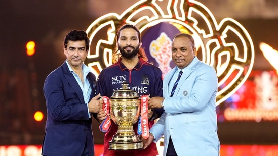 Rajat Patidar, Mitun Manhas and Devajit Saikia with the IPL trophy. (PTI)
