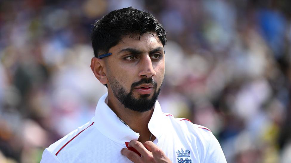 Shoaib Bashir looks on