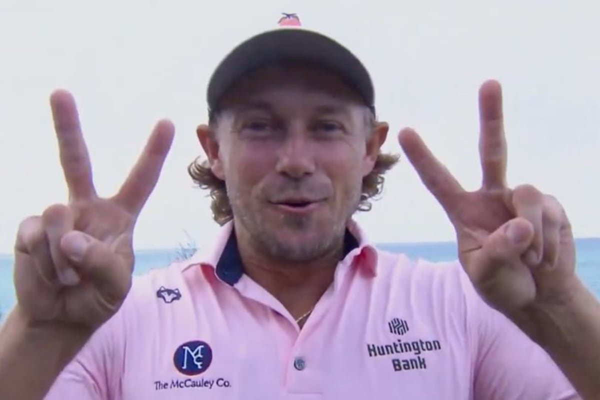 Austin Smotherman celebrates his second PGA Tour victory by raising two fingers on each hand