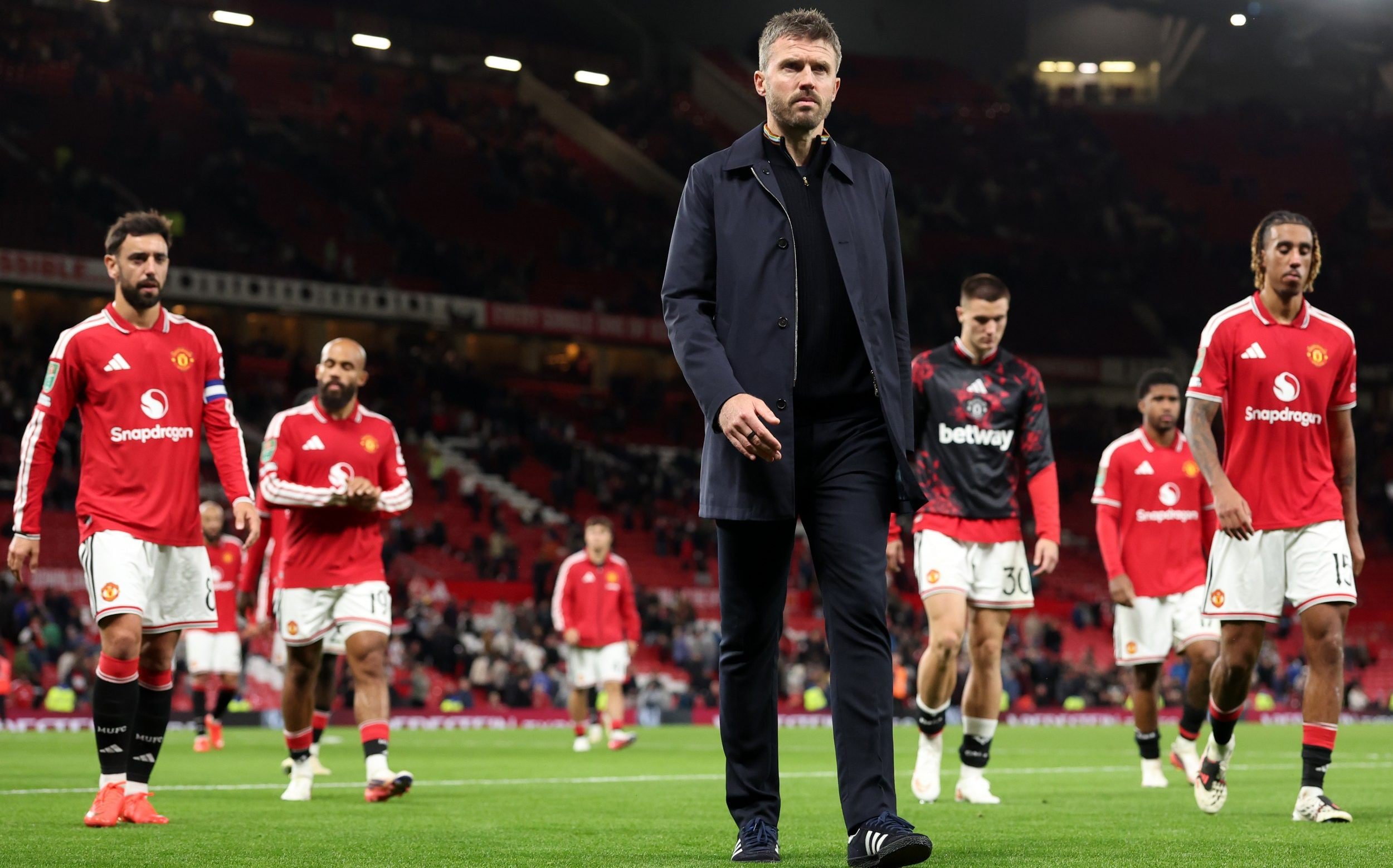 Michael Carrick, Manager of Manchester United, reacts