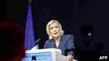 Former president of the French far-right Rassemblement National (RN) parliamentary group Marine Le Pen gives a speech during the results evening of the first round of the parliamentary elections in Henin-Beaumont, northern France, June 30, 2024. 