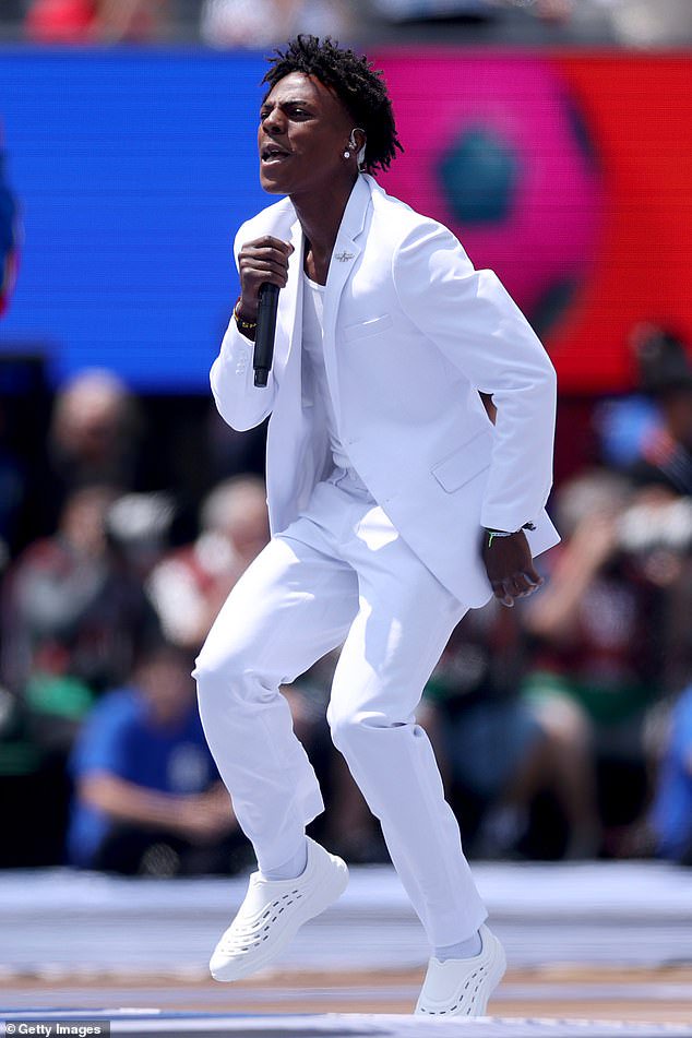 IShowSpeed, who boasts over 58 million subscribers on YouTube, dressed in an all-white suit