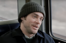 Jim Carrey on a train, wearing a knit cap and a jacket, from the movie &quot;Eternal Sunshine of the Spotless Mind.&quot;