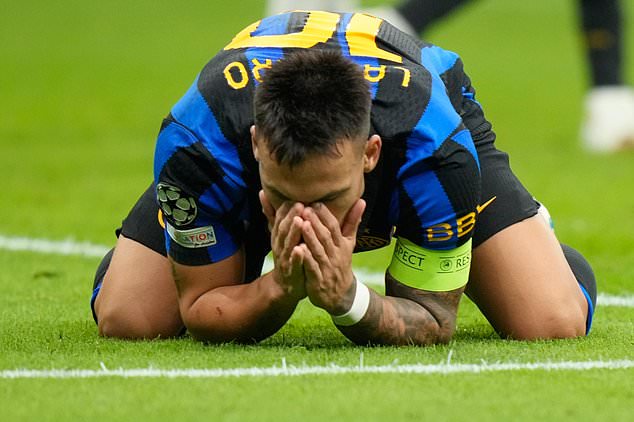 Inter Milan's Lautaro Martinez reacts after missing a scoring chance during the Champions League opening phase soccer match between Inter Milan and Club Brugge in Milan, Italy, Tuesday, Oct. 13, 2026. (AP Photo/Luca Bruno)