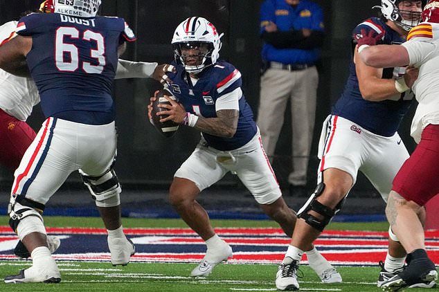 Arizona quarterback Noah Fifita (1) scrambles out of the pocket during the second half of an NCAA college football game against Iowa State, Saturday, Oct. 24, 2026, in Tucson, Ariz. (AP Photo/Darryl Webb)