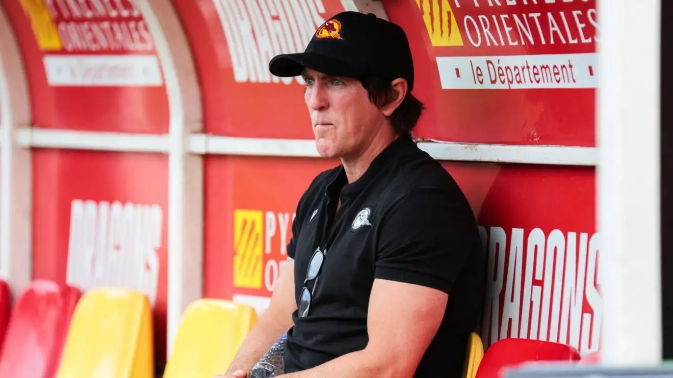Catalans Dragons interim head coach Ryan Sheridan pictured in the dugout at the Stade Gilbert Brutus ahead of a game in 2026