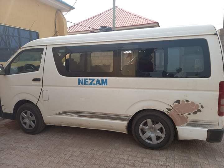 May be an image of car and text that says "NEZAM"