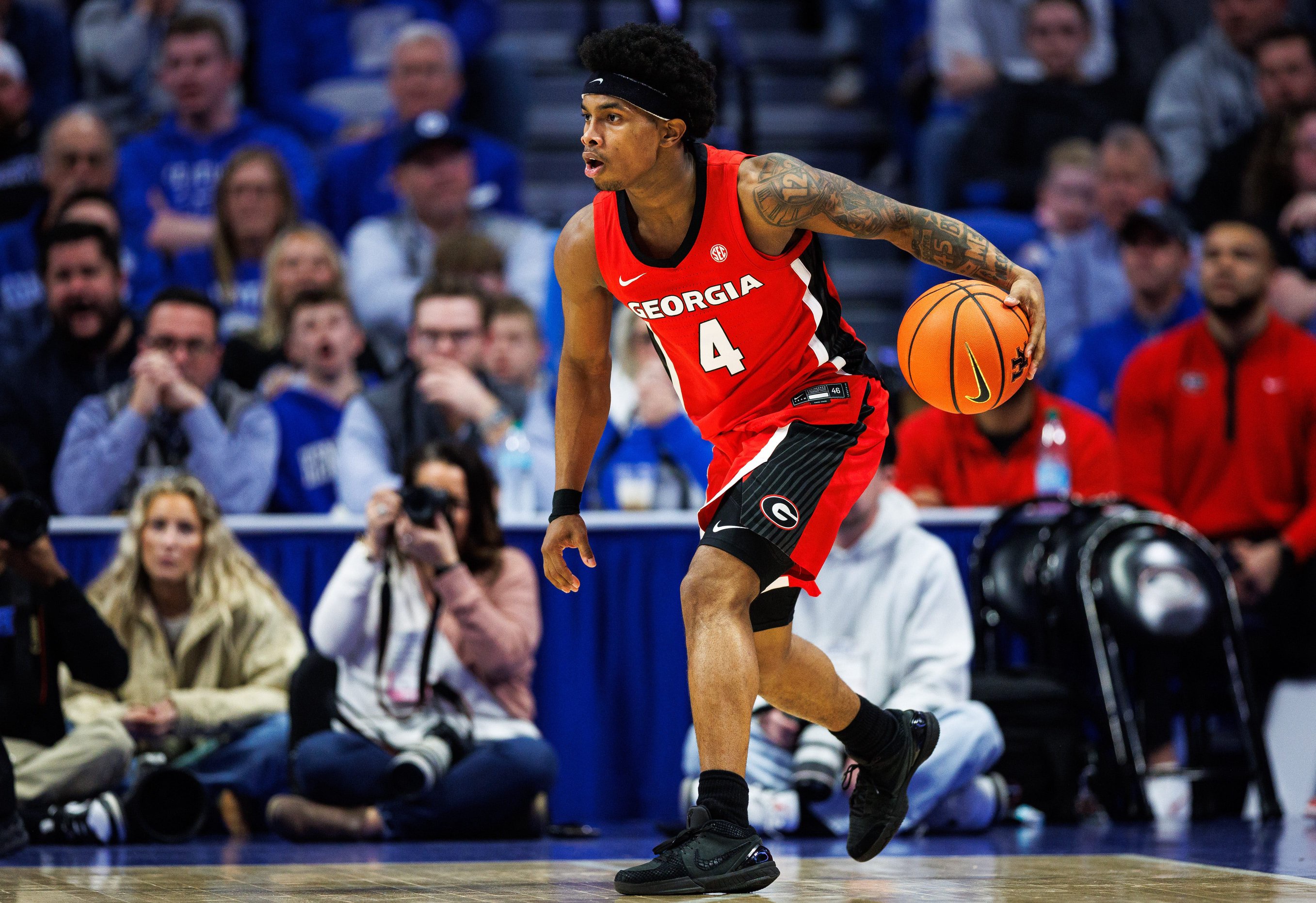 Feb 17, 2026; Lexington, Kentucky, USA; Georgia Bulldogs guard Marcus Millender (4) handles the ball during the second half against the Kentucky Wildcats at Rupp Arena at Central Bank Center. Mandatory Credit: Jordan Prather-Imagn Images