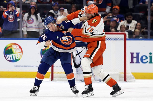 New York Islanders right wing Mitchell Chaffee (26) fights with Anaheim Ducks left wing A.J. Greer (18) during the second period of an NHL hockey game Tuesday, Oct. 20, 2026, in Elmont, N.Y. (AP Photo/Adam Hunger)