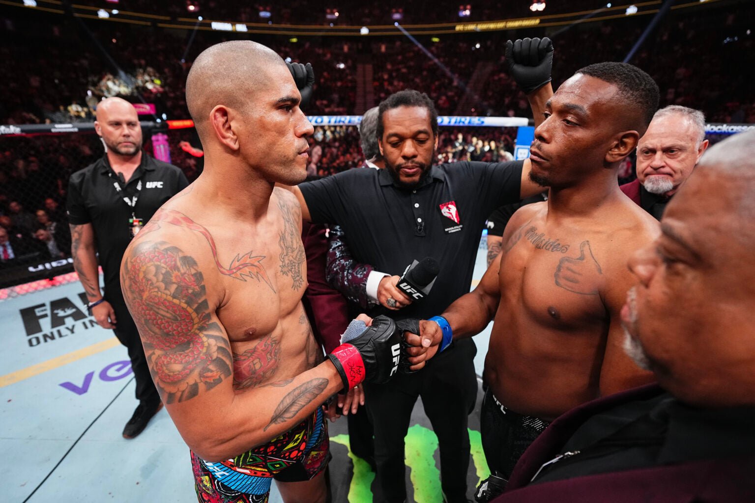 Alex Pereira and Jamahal Hill touch gloves before a UFC fight with Herb Dean standing between them