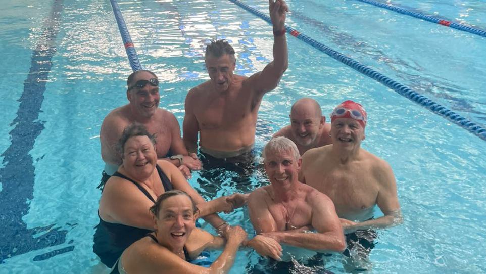 An 84-year-old lifeguard has proved that age is just a number after helping his team to victory in a swimming relay race <i>(Image: Supplied)</i>