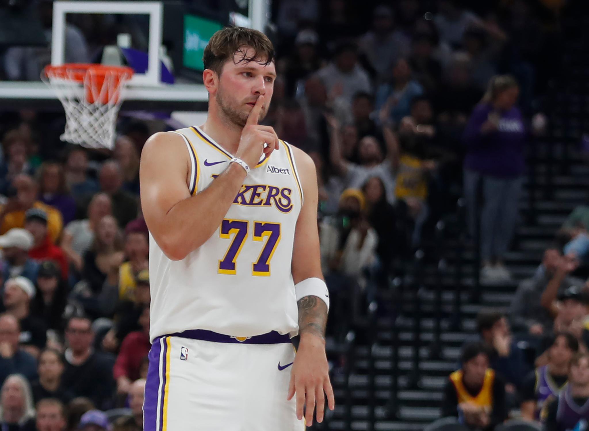 Luka Doncic (77) of the Los Angeles Lakers hushes the crowd after sinking a three pointer against the Utah Jazz during the second half of their game at the Delta Center in Salt Lake City, Utah, Sunday, Oct. 25, 2026.