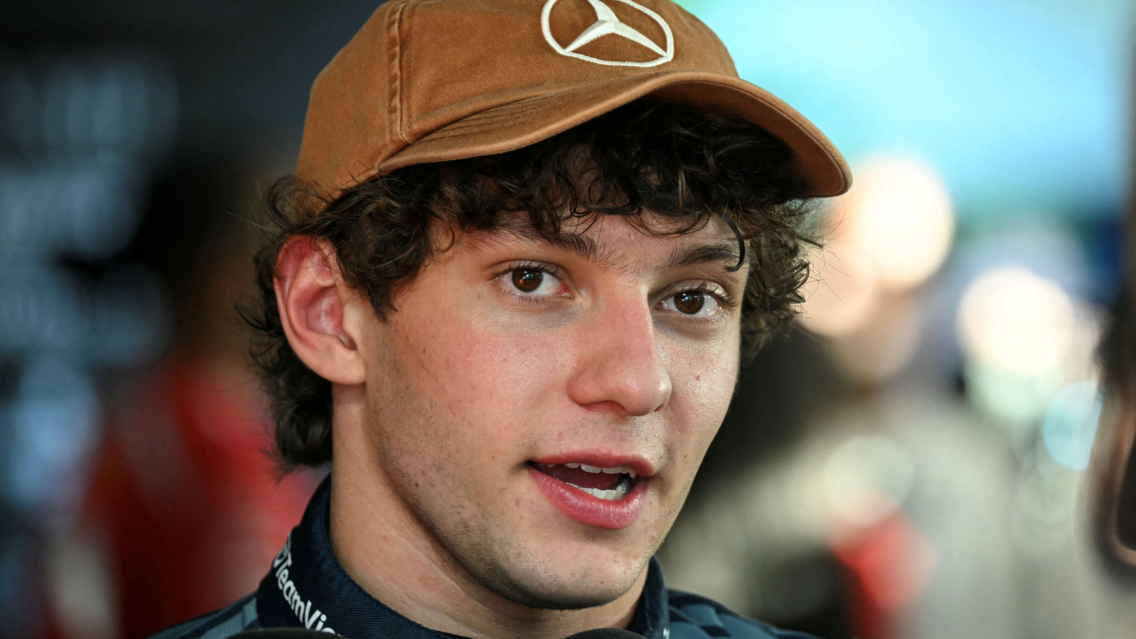 Kimi Antonelli wearing a Mercedes cap after taking pole position for the United States Grand Prix