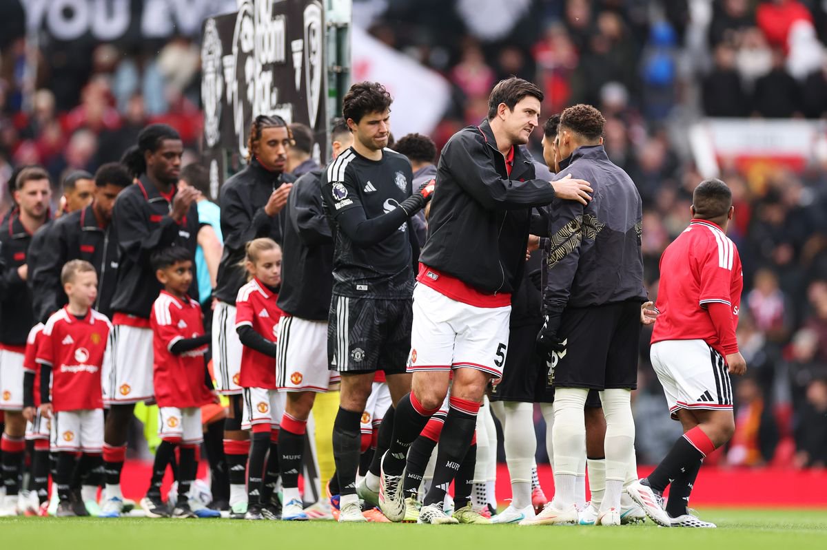 Harry Maguire of Manchester United pats Marcus Tavernier of Bournemouth before the Premier League 2026/27 match between Manchester United and AFC Bournemouth at Old Trafford on October 25, 2026 in Manchester, England. 