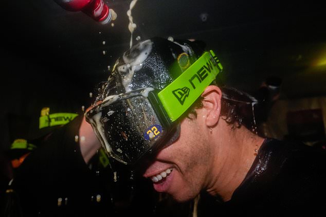 Milwaukee Brewers designated hitter Christian Yelich celebrates with teammates after winning baseball's World Series, against the Tampa Bay Rays, Wednesday, Oct. 28, 2026, in St. Petersburg, Fla. (AP Photo/Chris O'Meara)