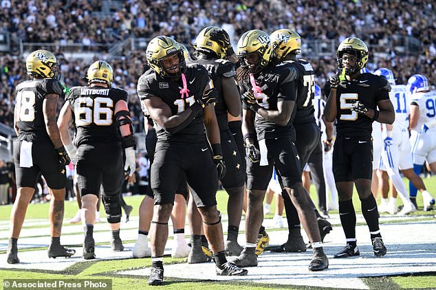 Central Florida running back Landen Chambers (11) celebrates his two-yard rushing touchdown during the first half of an NCAA college football game against BYU, Saturday, Oct. 24, 2026, in Orlando, Fla. (AP Photo/Phelan M. Ebenhack)