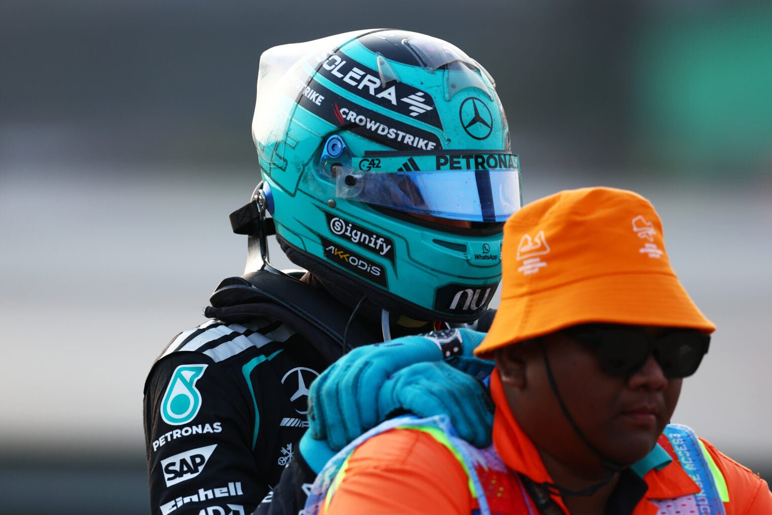 Mercedes driver George Russell is taken back to the pits after retiring from the 2026 Bahrain Grand Prix in Malaysia