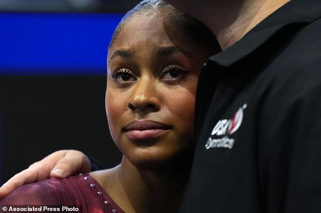 Skye Blakely, of the United States, and her coach wait for the scores after competing in the floor exercise during the women's all-around final at the Artistic Gymnastics World Championships in Rotterdam, the Netherlands, Friday, Oct. 23, 2026. (AP Photo/Patrick Post)