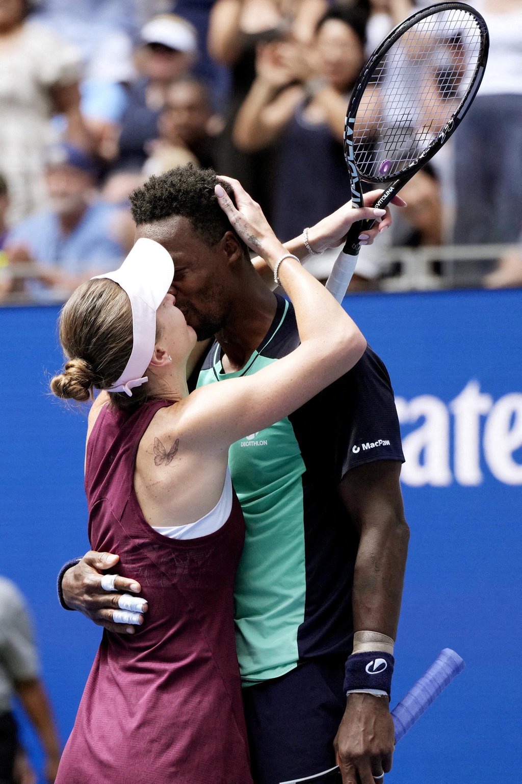Gael Monfils and Elina Svitolina celebrate winning their mixed doubles quarterfinal match at the U.S. Open.