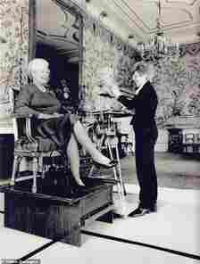 The Queen seen with Angela Conner during one of her six sittings in the Chinese Room at Buckingham Palace. The busts she produced were made for the Queen's 80th birthday in 2006