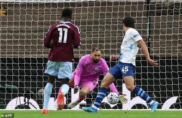 Nicolas Jackson (L) scores his second goal for Aston Villa against Manchester City at Villa Park