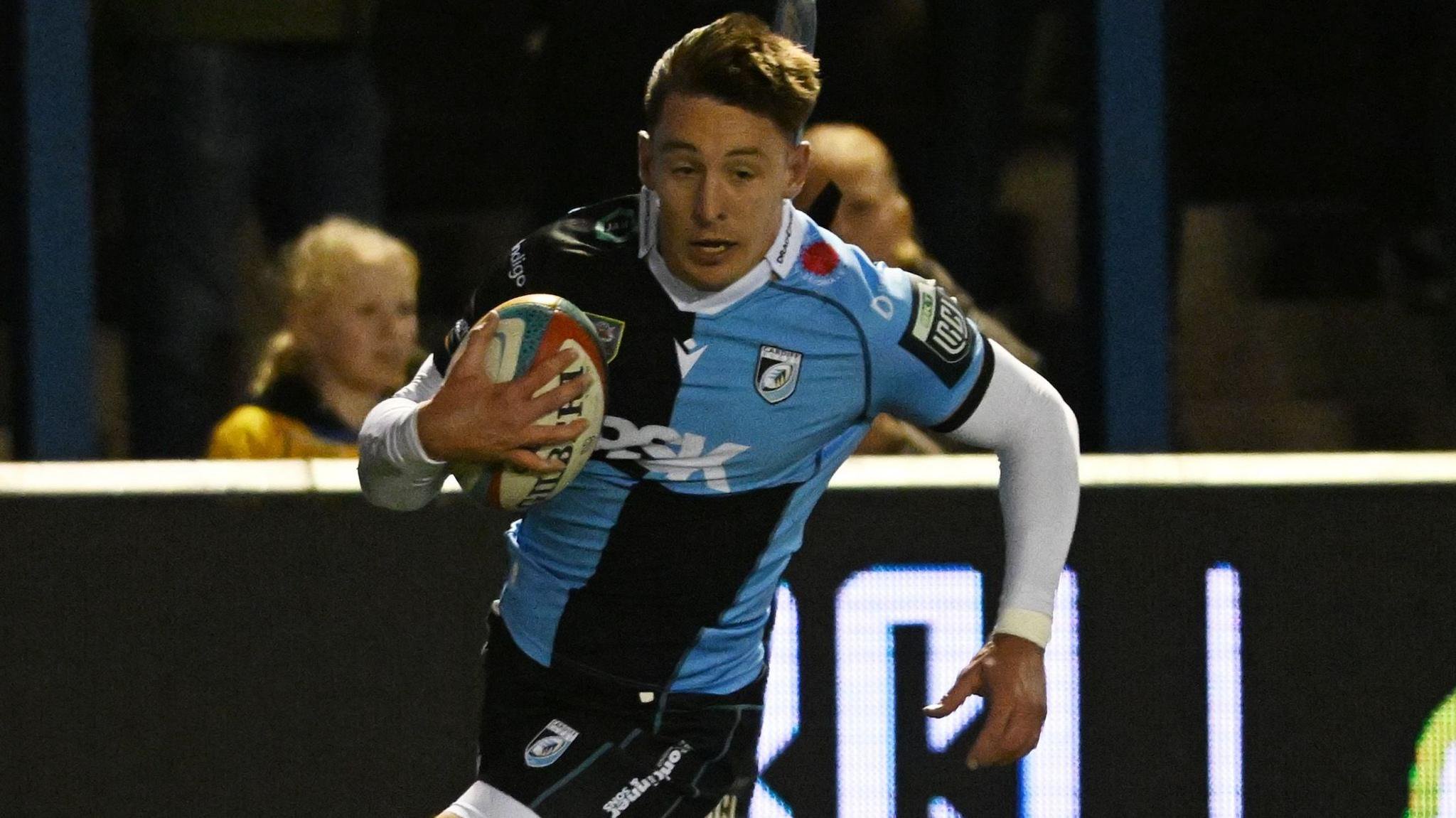 Josh Adams runs in a try for Cardiff against Sharks