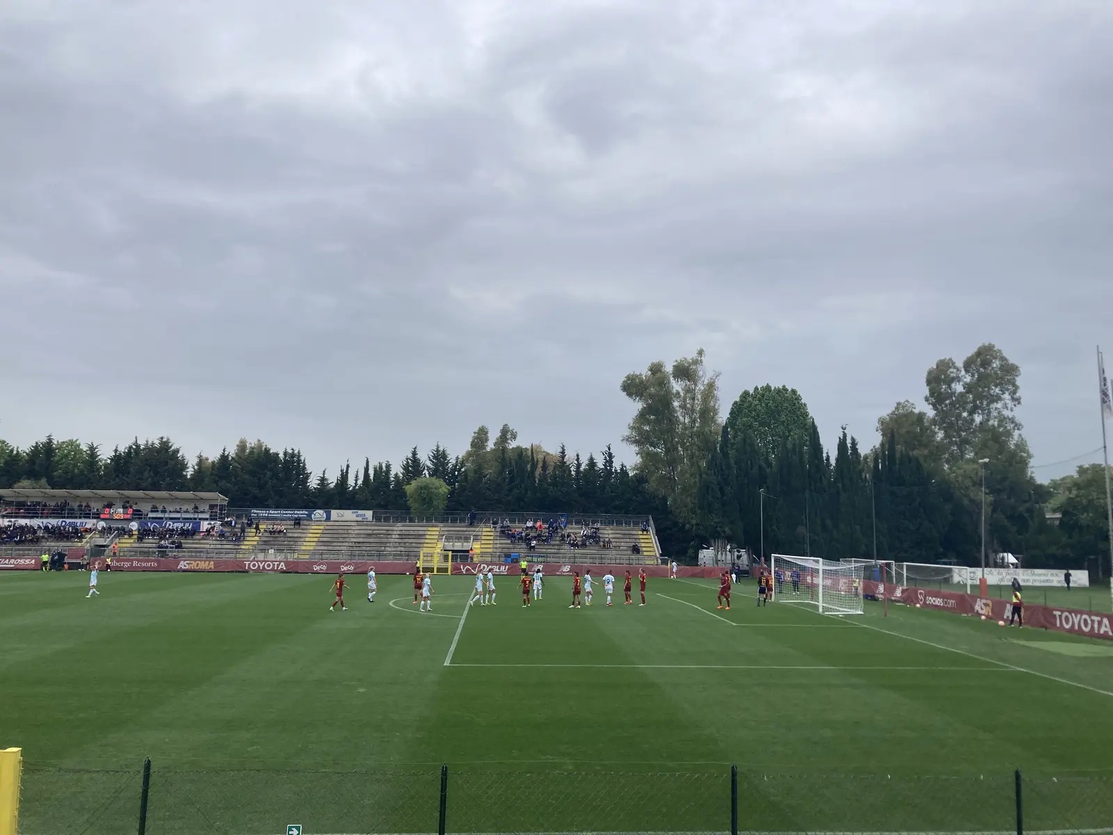Inter Milan Women players in white kits during a match against Roma.