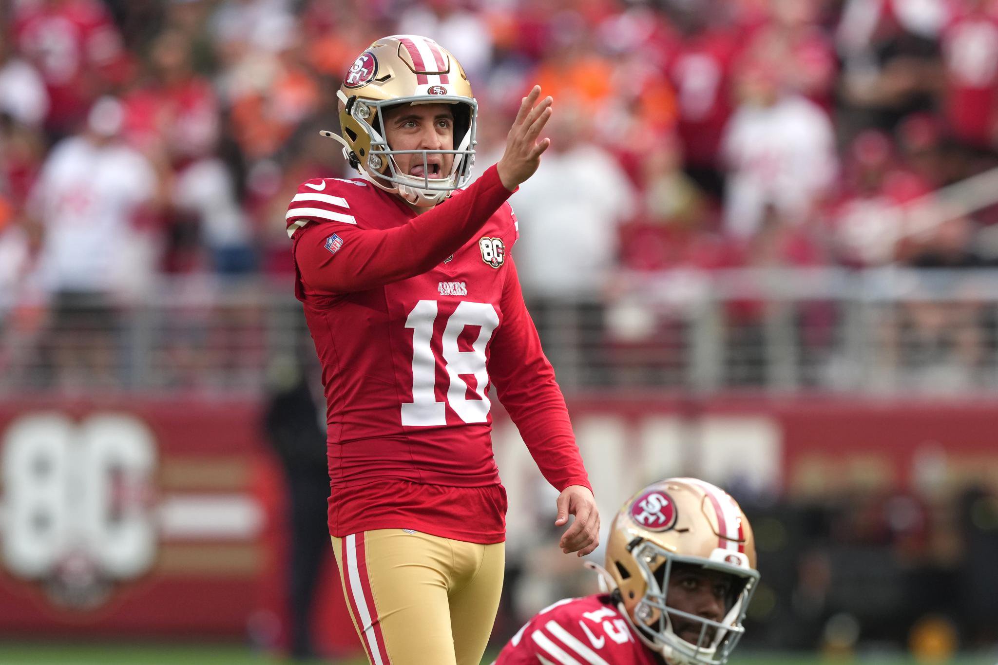 San Francisco 49ers place kicker Eddy Pineiro (18) gestures on the field.