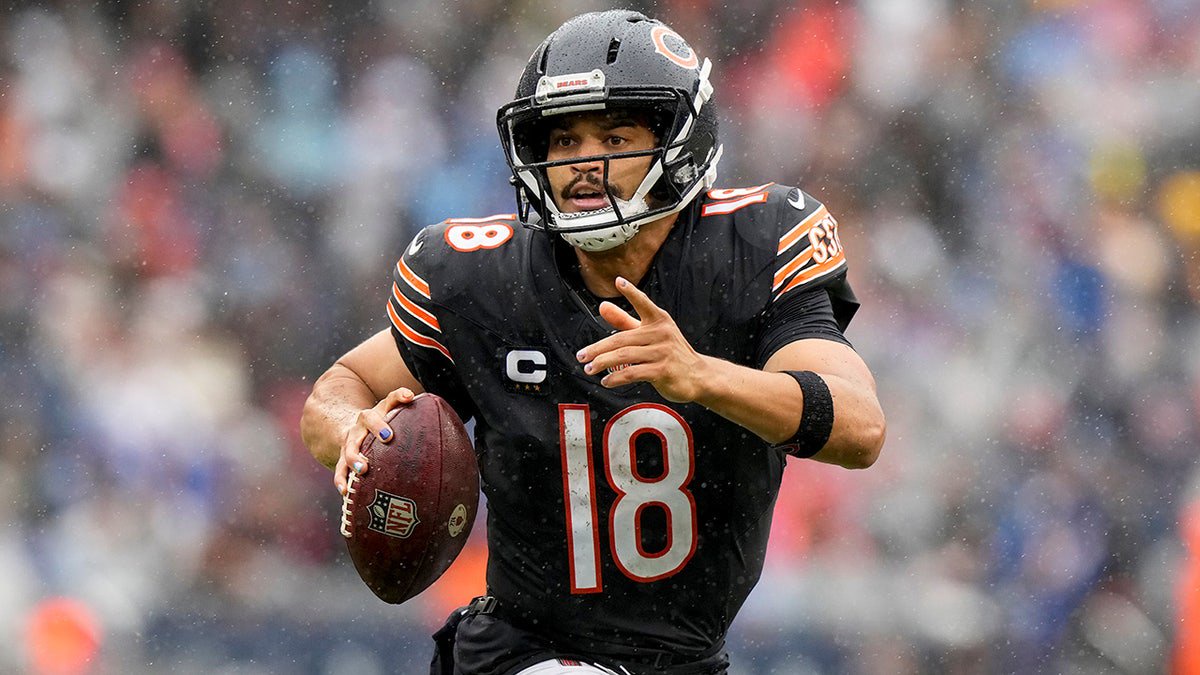 Chicago Bears quarterback Caleb Williams (18) runs with the football during the second half of an NFL football game against the Minnesota Vikings in Chicago, Sunday, Sept. 20, 2026. (AP Photo/Nam Y. Huh)