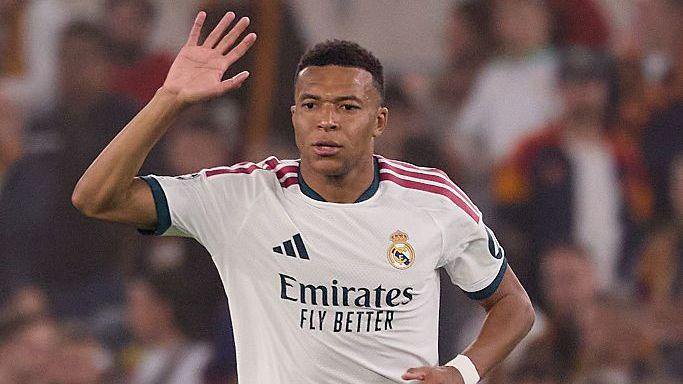 Kylian Mbappe celebrates scoring a goal against Roma
