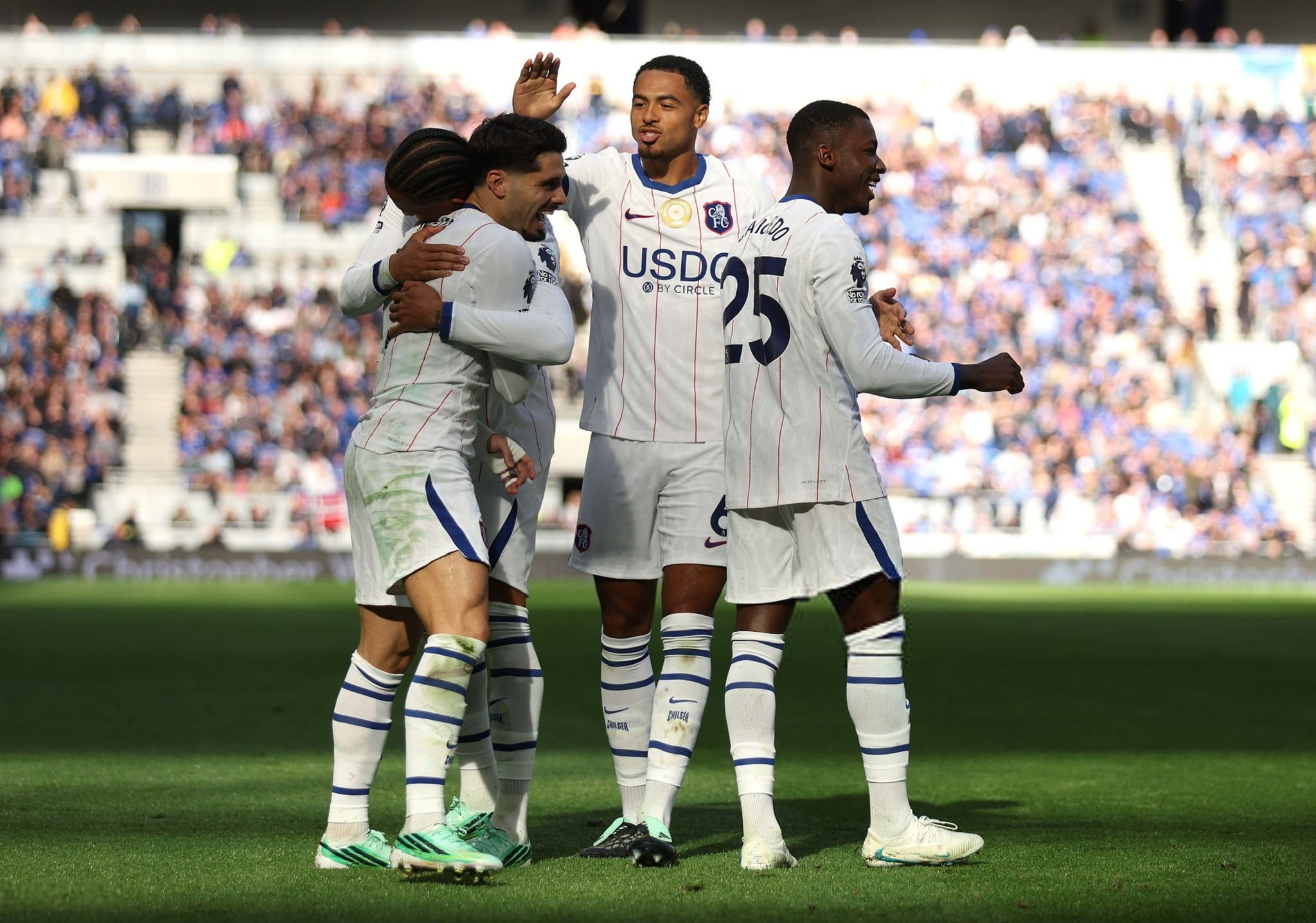 Chelsea players celebrate goal against Everton