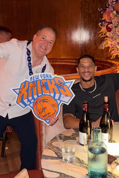 Chef Josh Capon also got several Knicks players to sign a Knicks necklace