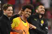 Trainer Edin Terzic head coach of Borussia Dortmund Karim Adeyemi  of Borussia Dortmund and Nuri Sahin celebrate with the fans after their sides vi...