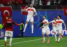 Turkey's Merih Demiral celebrates scoring their first goal with Ismail Yuksek and Ferdi Kadioglu [Thilo Schmuelgen/Reuters]