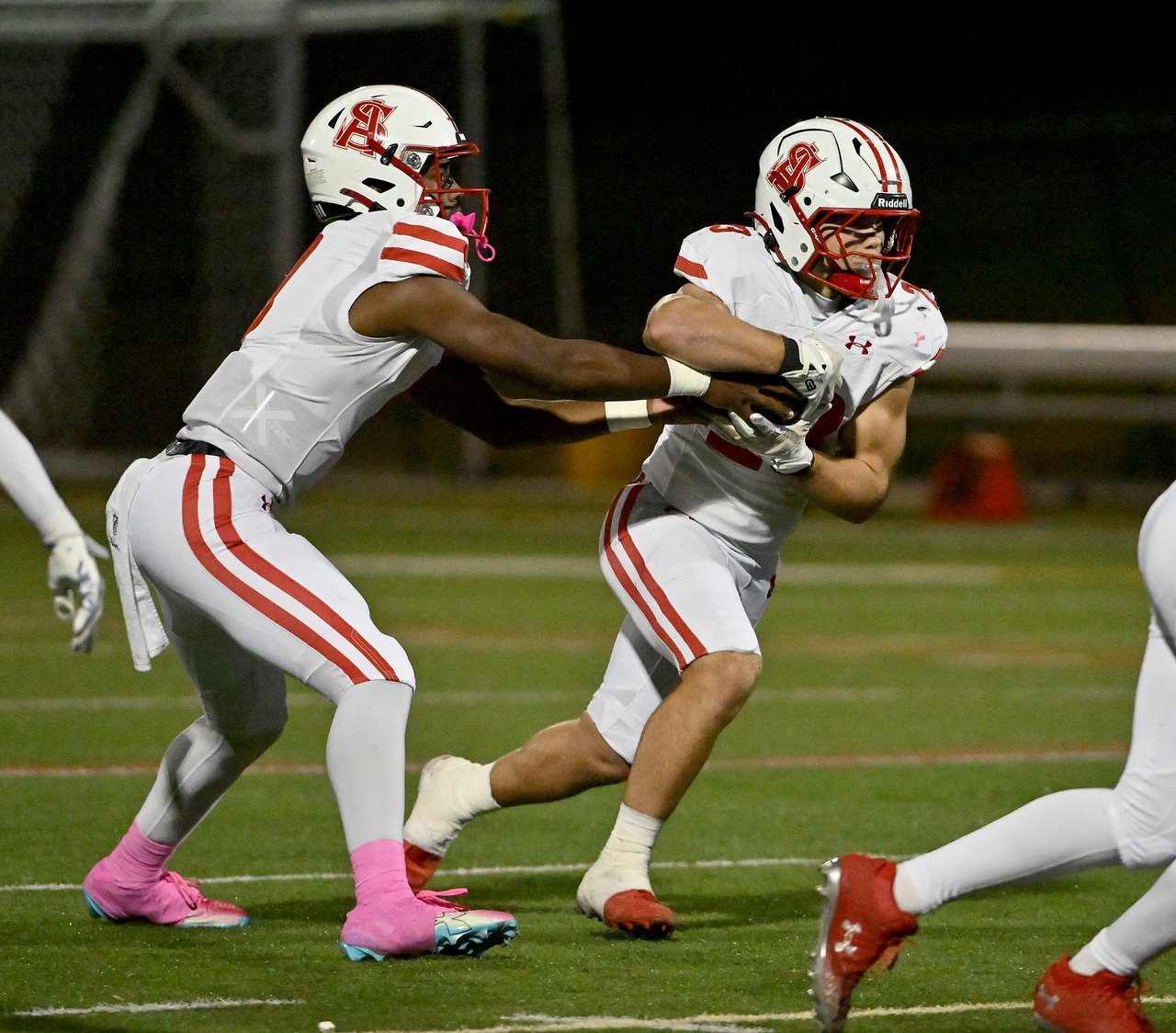 Archbishop Spalding Cavaliers Gabe Denius #23 runs after a handoff from quarterback Brian Snowden Jr. #9 during the first quarter. The Archbishop Spalding Cavaliers visit the St. Mary\xe2\x80\x99s Saints in a high school football matchup Friday evening. (Paul W. Gillespie/Staff)