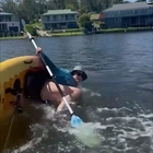 Kayaking 'Karen' gets instant karma! Woman launches foul-mouthed rant at family... then capsizes as she tries to splash them