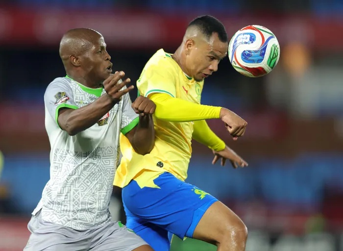 Fawaaz Basadien of Mamelodi Sundowns challenged by Samkele Sihlali of Marumo Gallants during the Carling Knockout Cup last 16 match at Loftus Versfeld Stadium.