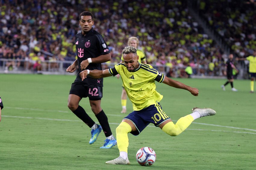 Nashville SC midfielder Hany Mukhtar (10) shoots and scores past Inter Miami CF forward Yannick Bright (42) during the second half at Geodis Park.