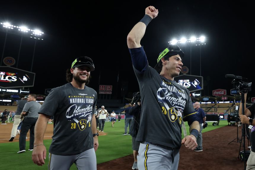 The Milwaukee Brewers' Christian Yelich raises a fist after the Brewers clinched their first World Series appearance since 1982.