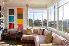 Inside, the home has been renovated to include modern interiors and furnishings, with pops of color found in each room