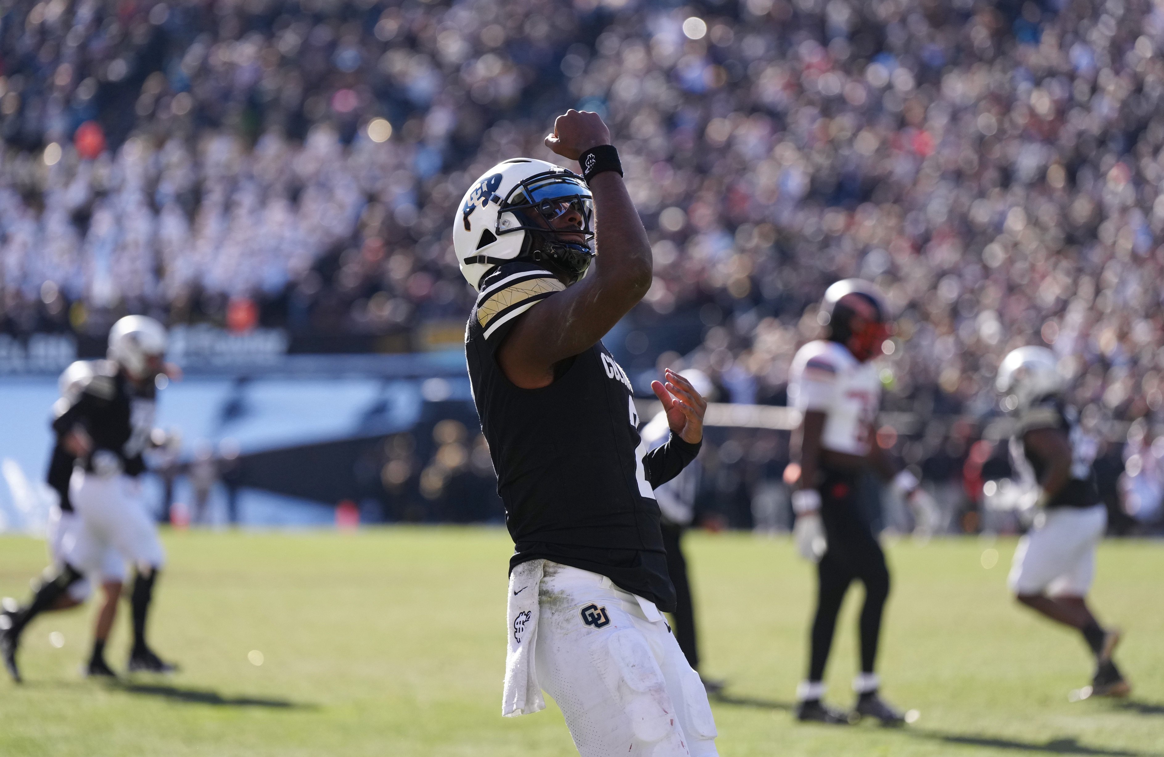 Nov 29, 2024; Boulder, Colorado, USA; Colorado Buffaloes quarterback Shedeur Sanders (2) celebrates a third quarter touchdown pass against the Oklahoma State Cowboys at Folsom Field. Mandatory Credit: Ron Chenoy-Imagn Images