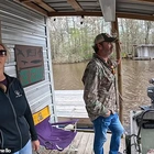 Off-grid couple who fled mainstream society to live on a houseboat deep in the lawless Louisiana SWAMP lift the lid on their very unique lifestyle that sees them hunting 'giant rats' for dinner and fending off ALLIGATORS