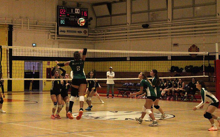 Naples girls’ volleyball team senior outside hitter Guliyana Pablo goes to slap the ball as Vicenza’s front line readies a defense during a semifinal game of the 2026 DODEA-Europe volleyball championships Division II tournament at the Ederle Fitness Center gym on Caserma Ederle in Vicenza, Italy, on Friday, Oct. 30, 2026. 