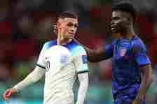 Phil Foden of England is congratulated by Bukayo Saka after their 3-0 victory in the FIFA World Cup Qatar 2022 Group B match between Wales and Engl...